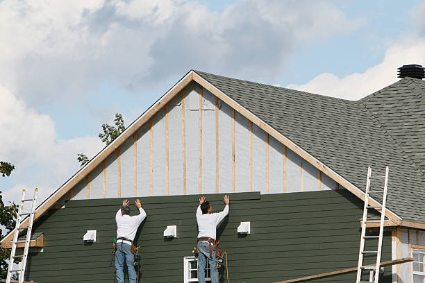 Professional Siding technician working in Weston, MA